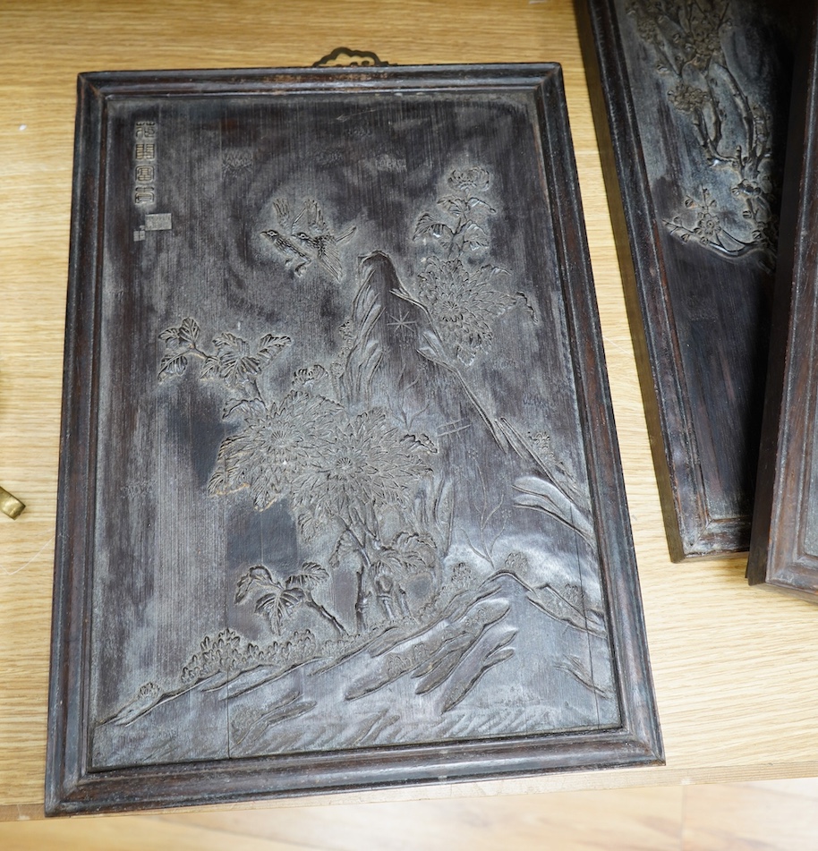 Four Chinese carved bamboo panels decorated with bamboo, trees, birds, etc. 48 x 34.5cm. Condition - fair to good.